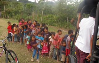 Chorti Mayan Chidren line up for volunteer school supply delivery, Honduras - Paramedics for Children